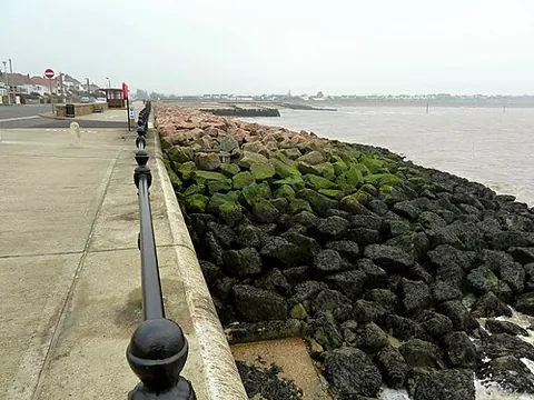 revetment: a layer of stone, concrete, or other hard material supporting the side of an embankment