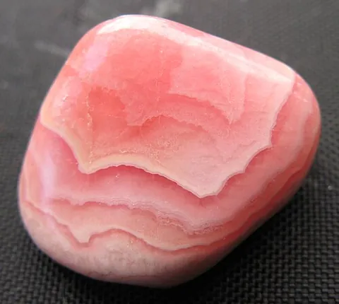 rhodochrosite: a crystalline mineral composed mainly of manganese carbonate MnCO₃