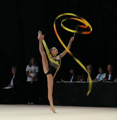 rhythmic gymnastics: a discipline of gymnastics where the gymnast manipulates one of five apparatuses (ribbon, ball,...