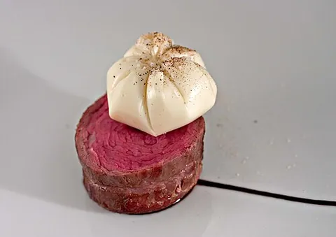 ribeye cap: a cut of beef formed by tying up the spinalis muscles in a cylinder shape