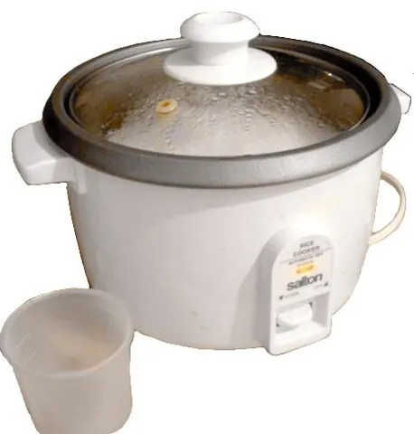 rice cooker: a kitchen appliance which is designed to cook rice, by either boiling or steaming it, and may also...