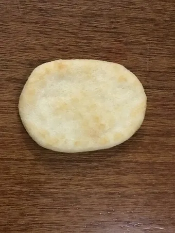 rice cracker: any of various types of cracker made from rice flour rather than wheat flour