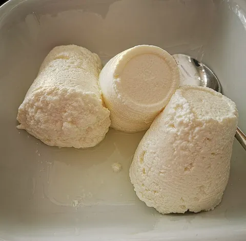 ricotta: a soft Italian unsalted whey cheese resembling cottage cheese
