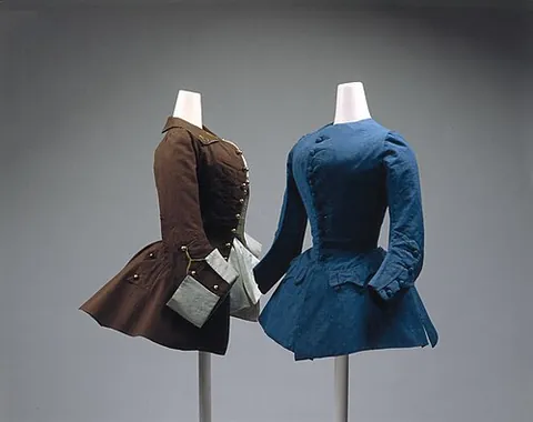 riding coat: a garment originally designed as an outerwear for horseback riding
