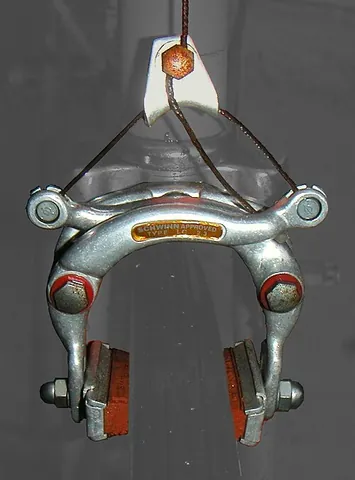 rim brake: a type of brake where two brake pads are pressed against the rotating wheelrim, slowing it down