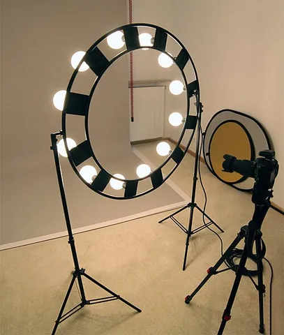 ring light: a continuous circular strip of light around a camera lens (either directly on the rim or as a...