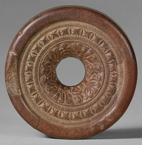 ringstone: a carved, contoured, donut-shaped stone object in early Indian art