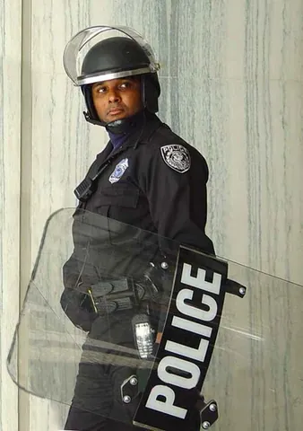 riot shield: a lightweight handheld protection device, generally used in riot control