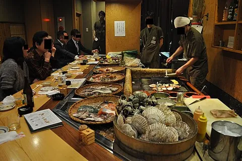 robata: a charcoal grill used to prepare Japanese food for customers seated around the cooking area