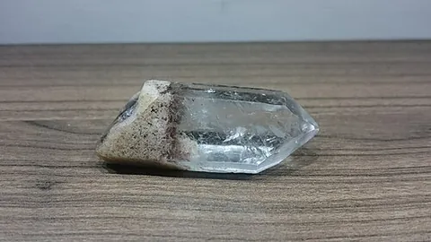 rock crystal: a clear, colorless form of the silica-based mineral quartz