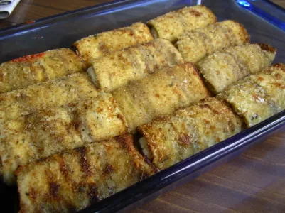 rollatini: an Italian-style dish made with thin slices of meat or eggplant dusted in wheat flour or lightly...