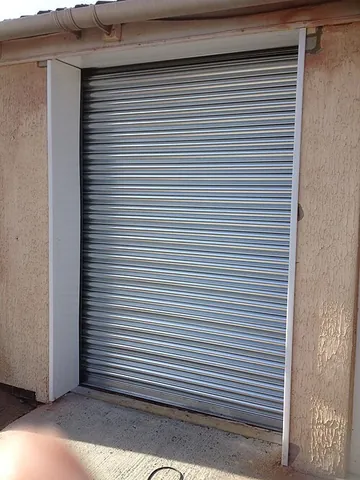 roller shutter: a shutter (for a window or door) consisting of a series of horizontal sections that are hinged...