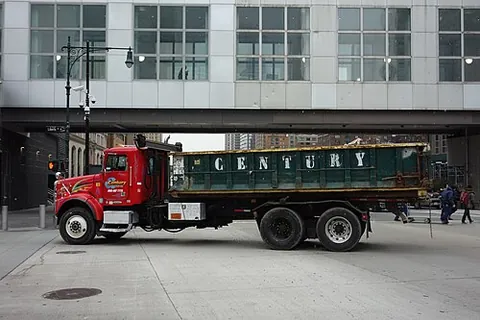 rolloff: able to be rolled off (and later, rolled back onto) the bed of a flatbed truck (flatbed lorry) in a...