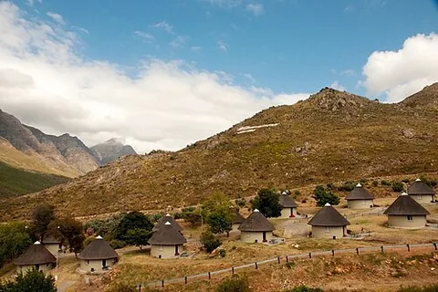 rondavel: a traditional circular design of house, typically with a conical roof, commonly thatched. Still...