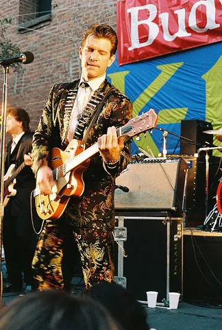 roots-rock: a genre of popular rock music influenced by Americana and roots music