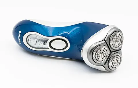 rotary shaver: an electric shaver with three or more circular heads that rotate to capture and cut hairs; designed...