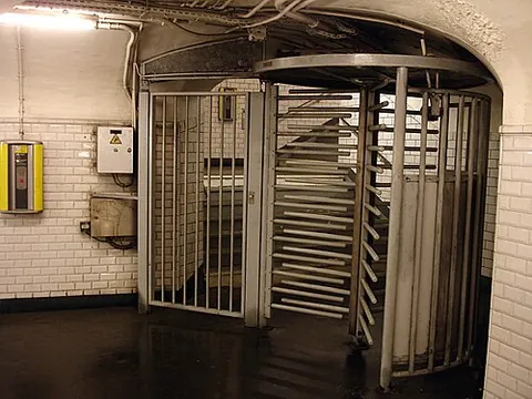 rotogate: a turnstile with its height extended to the height of a person, similar to a revolving door