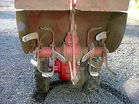rototiller: a motorized cultivator having rotating blades