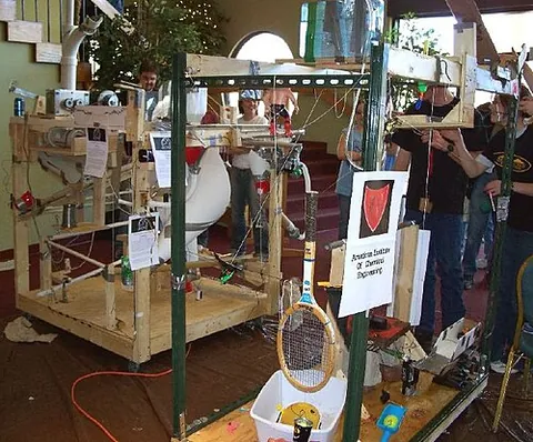 rube goldberg machine: a comical, overcomplicated machine which performs a simple task