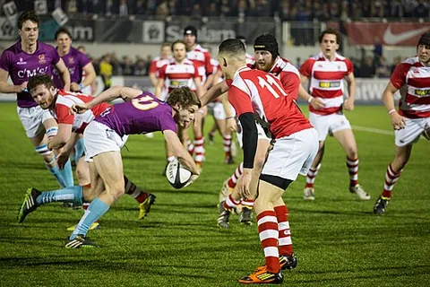 rugby: a form of football in which players can hold or kick an ovoid ball; rugby football. The ball cannot...