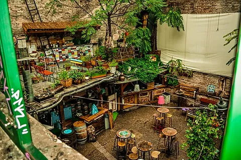 ruin pub: a bar, selling alcoholic beverages, inhabiting an old building left in a ramshackle condition; a...