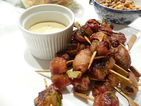 rumaki: a mock-Polynesian hors d'oeuvre, usually made from water chestnuts and pieces of duck or chicken...