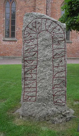 runestone: an ancient monument consisting of a typically raised stone with a runic inscription