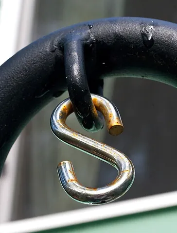s-hook: a piece of hardware consisting of a rod or thick wire bent into S-shaped form