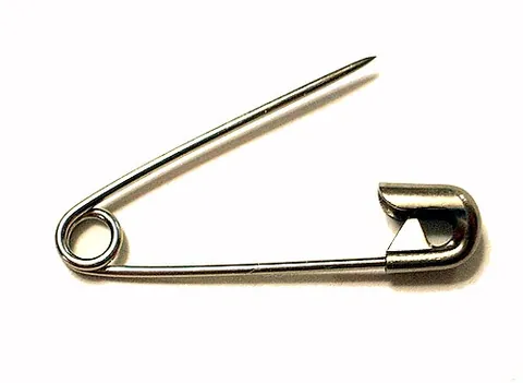 safety pin: a pin in the form of a clasp, which has a guard to cover the sharp point; used to join two pieces...