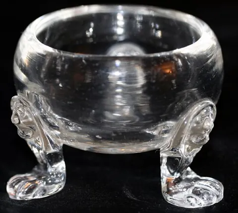 salt cellar: a small open container holding salt for use in the kitchen or on a dining table