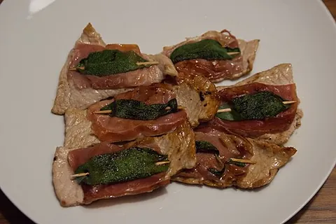 saltimbocca: an Italian dish of veal, thinly sliced and rolled in prosciutto ham and sage leaves