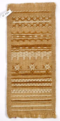 sampler: a piece of needlework embroidered with a variety of designs