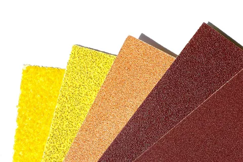 sandpaper: strong paper coated with (traditionally) sand or (today) manufactured aluminum oxide, silicon...