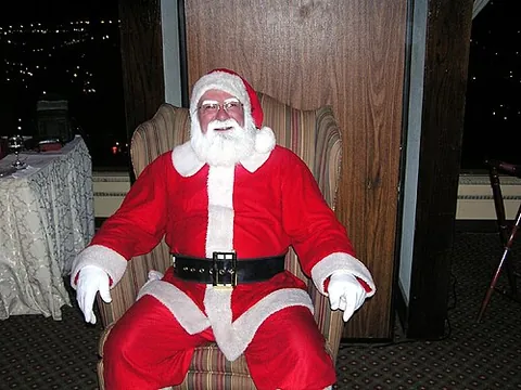 santa suit: a red and white costume associated with Santa Claus, normally including an ostentatious black belt