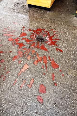 sarajevo rose: a kind of war memorial in Sarajevo made by filling the concrete scar from a shell explosion with...