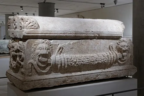sarcophagus: a stonen coffin, often with its exterior inscribed, or decorated with sculpture