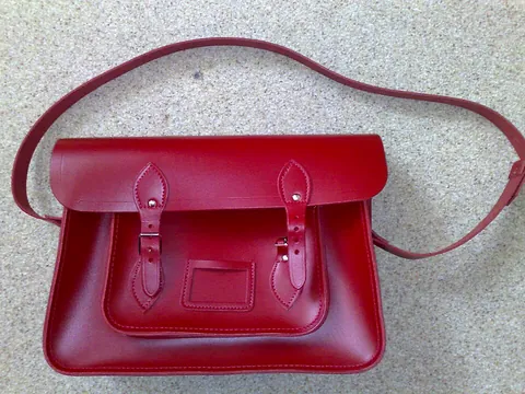 satchel: a bag or case with one or two shoulder straps, especially used to carry books etc