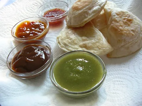 sauce: a liquid (often thickened) condiment or accompaniment to food