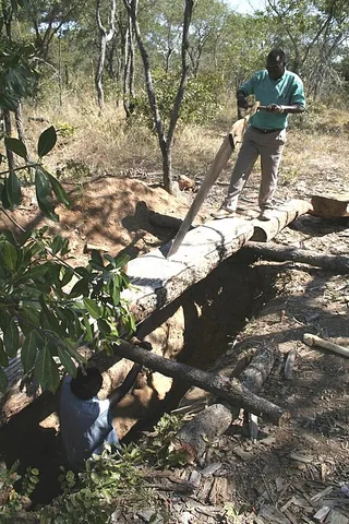 sawpit: a pit over which lumber is positioned to be sawn with a long two-handled saw (a pitsaw) by two...