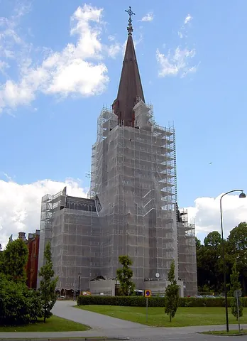 scaffold: a structure made of scaffolding for workers to stand on while working on a building