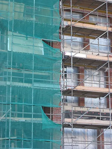 scaffolding: a temporary modular system of tubes, bamboo or wood forming a framework used to support people and...