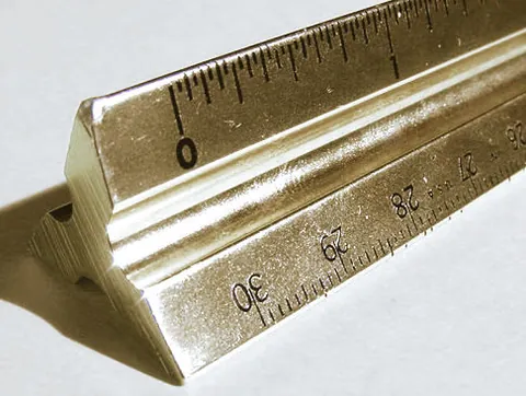 scale ruler: a ruler marked with a range of calibrated scales (ratios) for drawing and measuring from reduced...