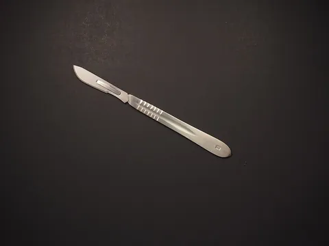 scalpel: a small straight knife with a very sharp blade used for surgery, dissection and craftwork
