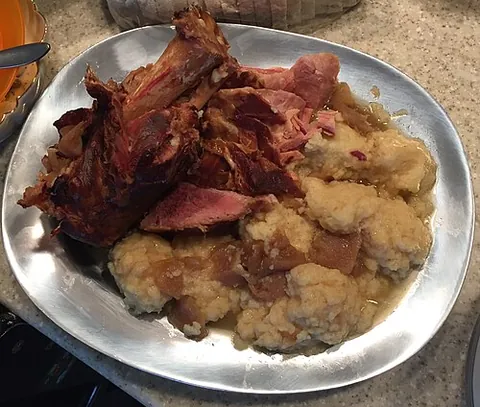 schnitz un knepp: a Pennsylvania Dutch dish of ham or pork shoulder with dried apples and dumplings