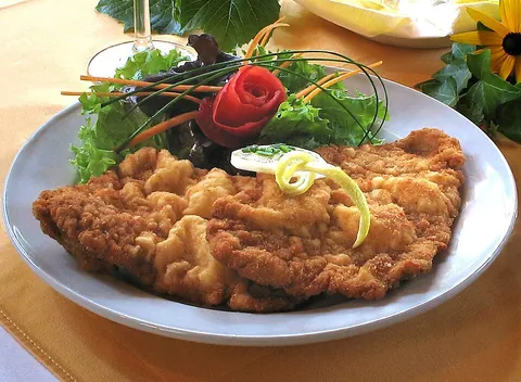 schnitzel: a dish consisting of fried veal cutlet