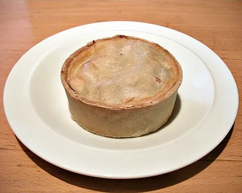 scotch pie: a small double-crust meat pie eaten in the United Kingdom and Canada