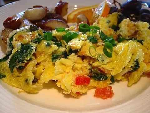 scrambled egg: a dish made by beating and cooking eggs, sometimes mixed with milk, and typically stirred while...