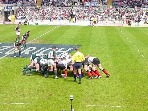 scrum: a tightly packed and disorderly crowd of people