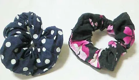 scrunchie: a small elasticated ring of fabric placed around long hair to hold it in place behind the head