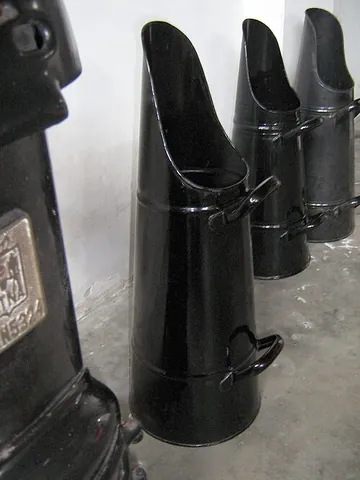 scuttle: a container like an open bucket (usually to hold and carry coal)